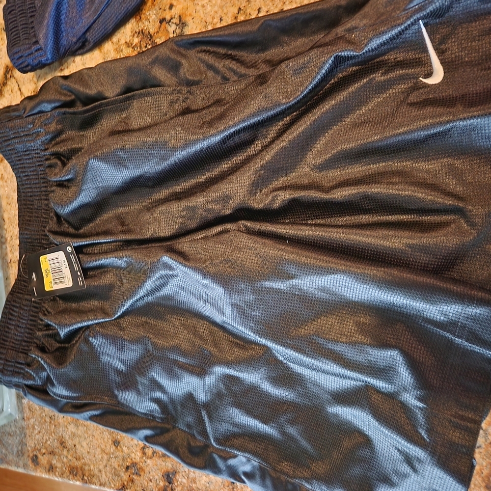 4 pair mens Nike basketball shorts (small and medium)